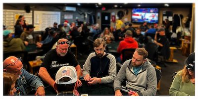 Full poker room with 99 entrants